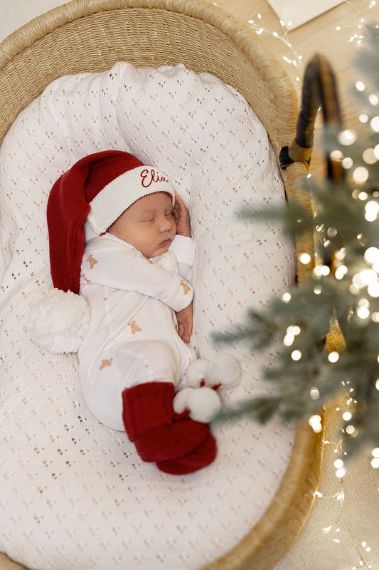Julebooties med hvite pompom dusker